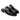 The Milano Horsebit Mule, constructed from Italian cowhide leather, is presented as a pair of Obsidian Black slip-on loafers with gold detailing on a white background. They feature a sleek look and low heel, enhanced by Blake stitch construction for lasting elegance.