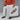 A person in a rust sweater and white pants holds a large poster showing the Mercer Penny // Maple Brown by Anthony Veer, which they also wear. The poster reads: Mercer Penny · Maple Brown.